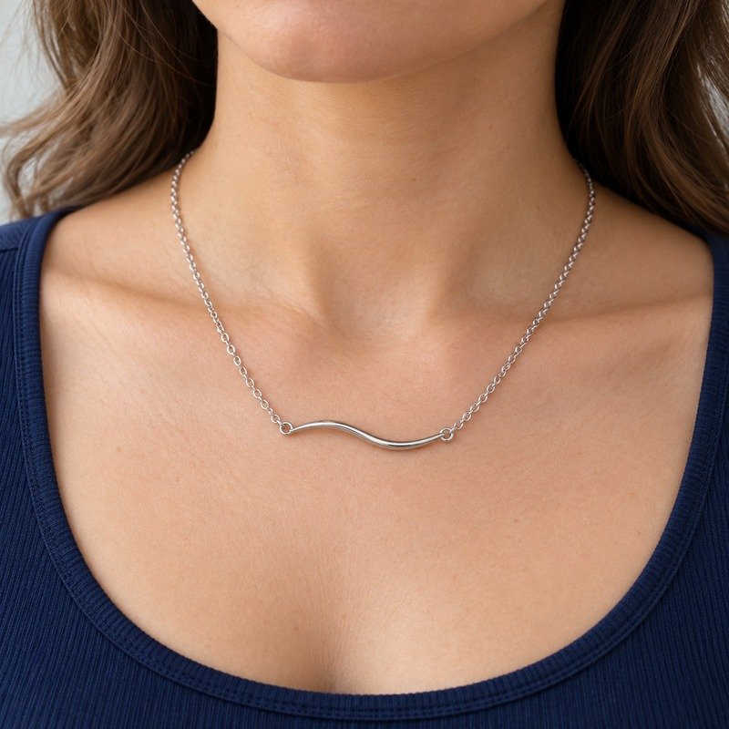 womens silver Stainless Steel wave necklace, worn by an adult model