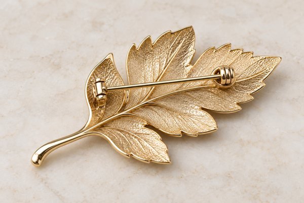 Illustrative Reverse of a leaf brooch with pin mechanism