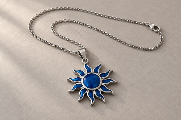Stainless steel sun-shaped pendant with blue enamel