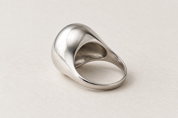 silver stainless steel sculptural dome ring: side profile of dome ring revealing hollow underside
