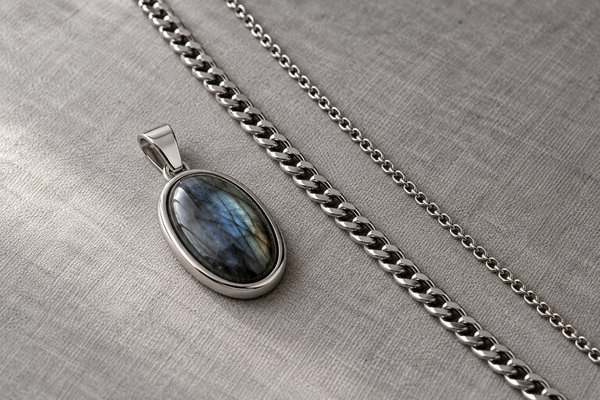 silver stainless steel oval gemstone pendant with integrated bail: pendant alongside two chains of different widths