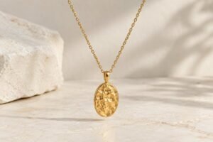 Illustrative Oval pendant suspended from a fine chain