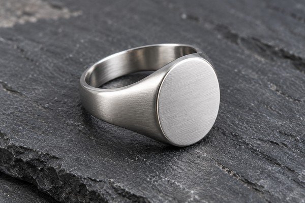 Brushed silver signet ring surface detail