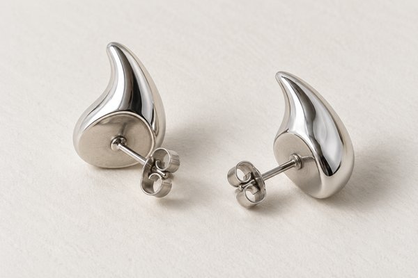 silver stainless steel sculptural teardrop stud earrings: back view showing stud posts and butterfly backs