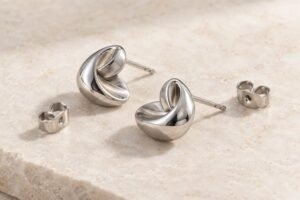 Illustrative Stud earring pair with separate butterfly backs