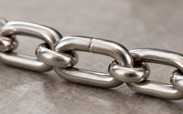 Close view of stainless steel chain links and joints
